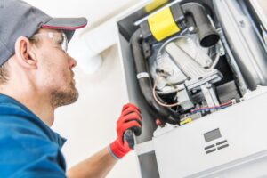 Man servicing boiler